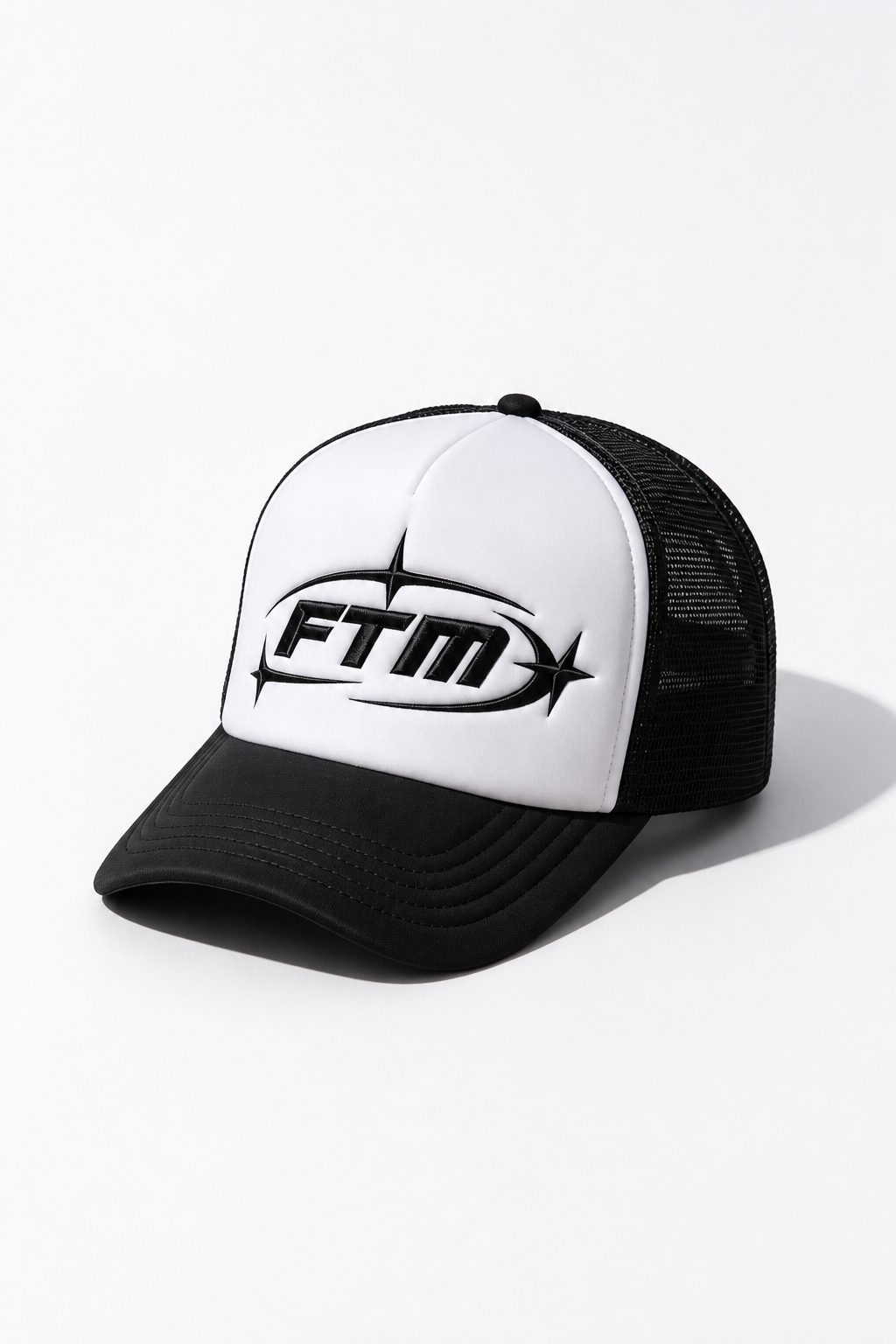 A black and white trucker hat with a white front panel, black brim, and black mesh back, featuring a black &