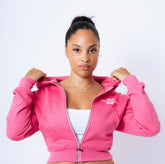 The model, 5 ft 4, wearing a small cropped hoodie. 