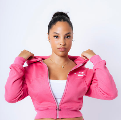 The model, 5 ft 4, wearing a small cropped hoodie. 