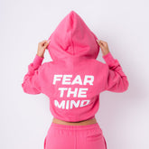 model, 5 ft 4 in a small cropped FTM hoodie