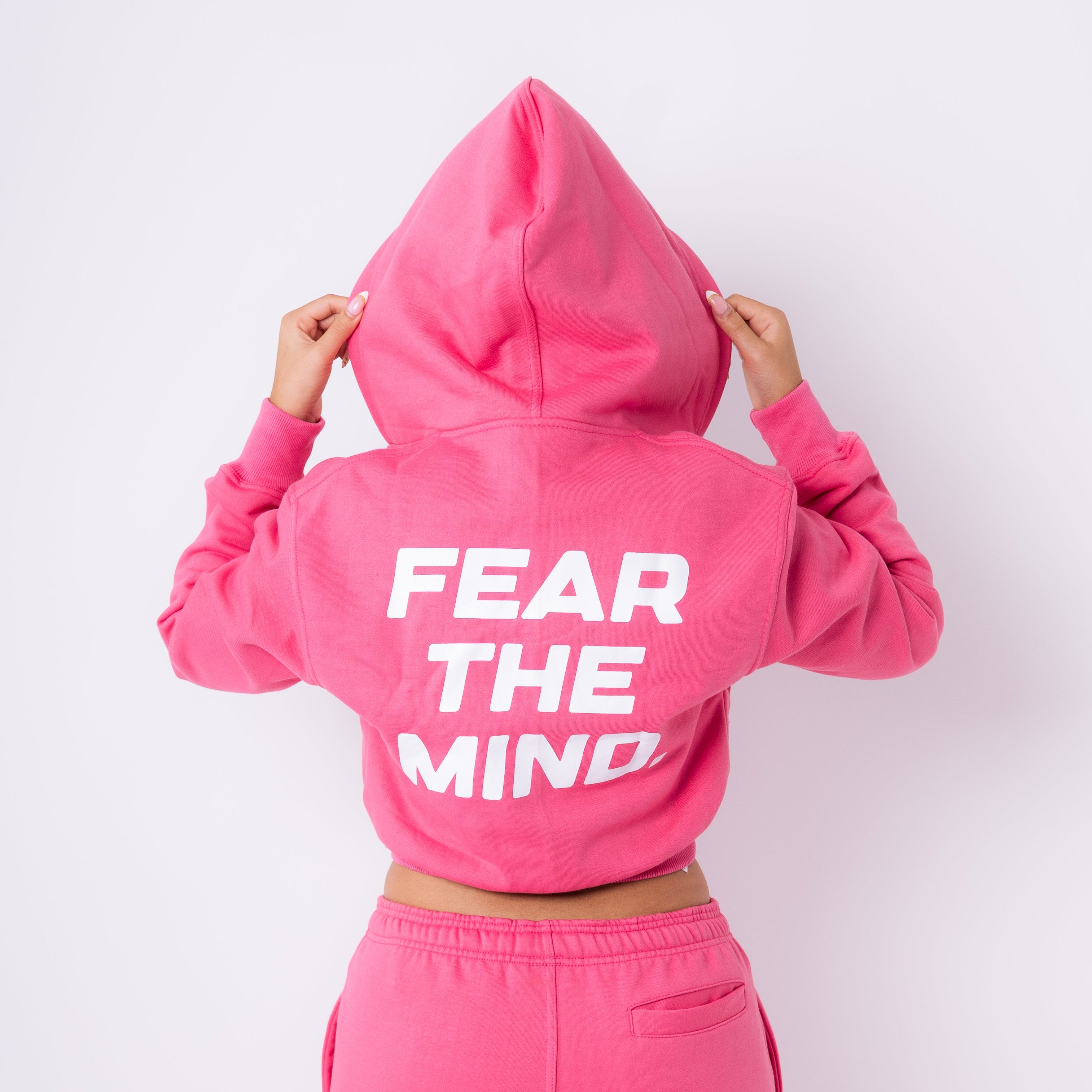 model, 5 ft 4 in a small cropped FTM hoodie